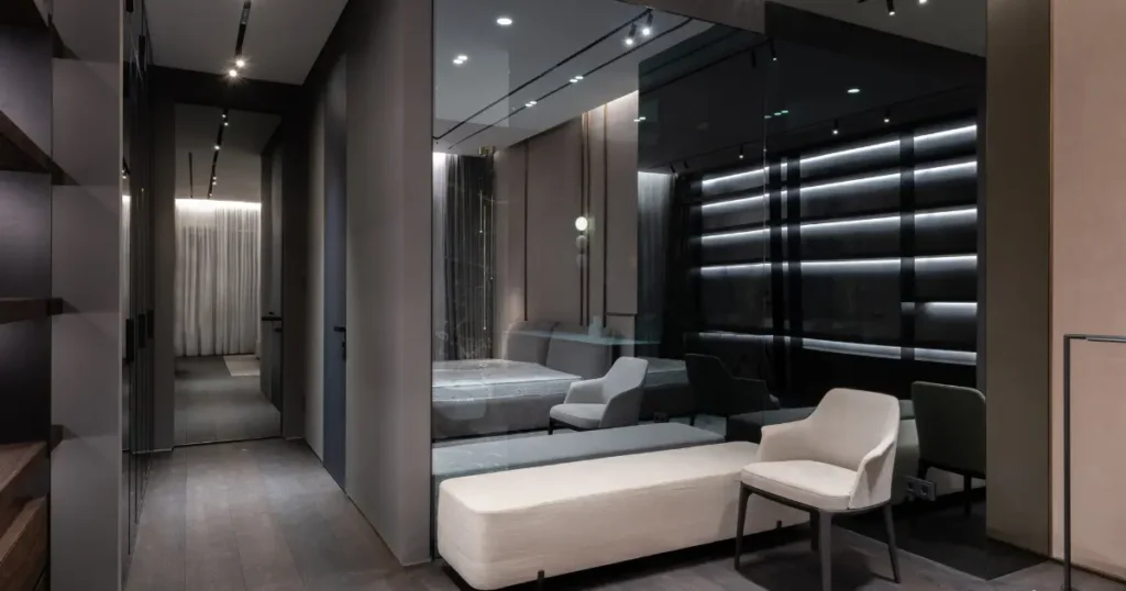 Kamar tidur desain interior 2025 dengan tempat tidur kayu, tanaman hias, dan lampu pintar yang dapat diatur melalui aplikasi